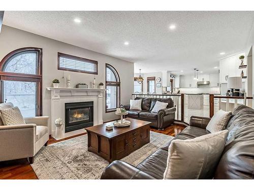 89 Hawkside Road Nw, Calgary, AB - Indoor Photo Showing Living Room With Fireplace