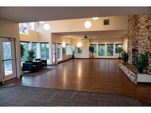 89 Hawkside Road Nw, Calgary, AB - Indoor Photo Showing Living Room With Fireplace