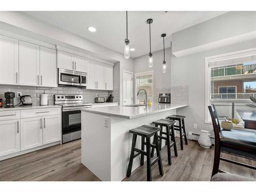 102-360 Harvest Hills Common Ne, Calgary, AB - Indoor Photo Showing Kitchen With Upgraded Kitchen