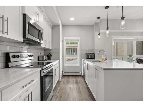 102-360 Harvest Hills Common Ne, Calgary, AB - Indoor Photo Showing Kitchen With Upgraded Kitchen