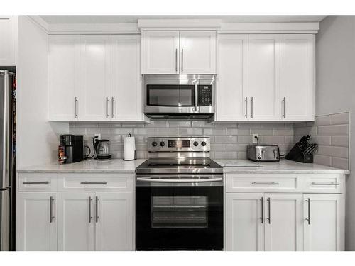 102-360 Harvest Hills Common Ne, Calgary, AB - Indoor Photo Showing Kitchen