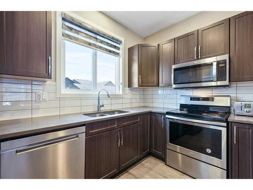 221 Seton Circle Se, Calgary, AB - Indoor Photo Showing Kitchen With Double Sink