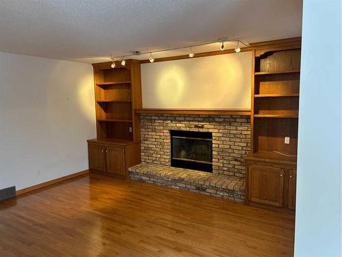 296 Edgebank Circle Nw, Calgary, AB - Indoor Photo Showing Living Room With Fireplace