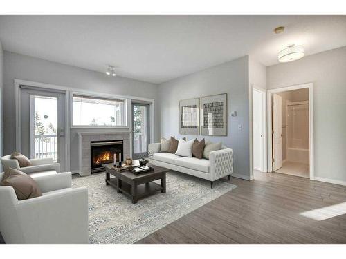 301-4507 45 Street Sw, Calgary, AB - Indoor Photo Showing Living Room With Fireplace