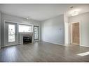 301-4507 45 Street Sw, Calgary, AB  - Indoor Photo Showing Living Room With Fireplace 