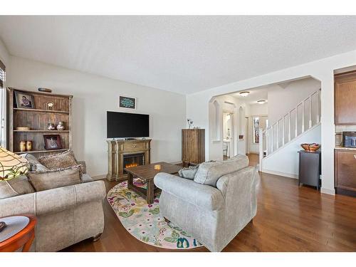 44 Sage Hill Point Nw, Calgary, AB - Indoor Photo Showing Living Room With Fireplace