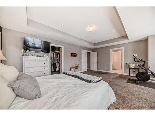 144 Baysprings Court Sw, Airdrie, AB - Indoor Photo Showing Bedroom