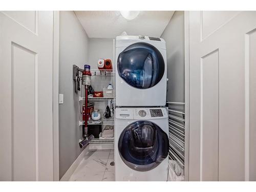 144 Baysprings Court Sw, Airdrie, AB - Indoor Photo Showing Laundry Room