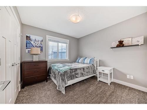 144 Baysprings Court Sw, Airdrie, AB - Indoor Photo Showing Bedroom