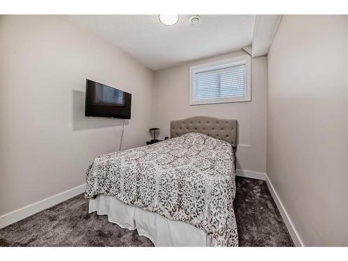 144 Baysprings Court Sw, Airdrie, AB - Indoor Photo Showing Bedroom