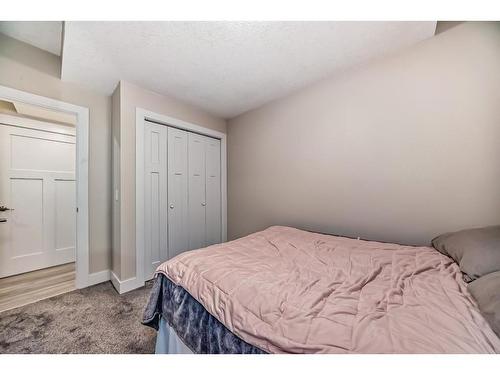 144 Baysprings Court Sw, Airdrie, AB - Indoor Photo Showing Bedroom