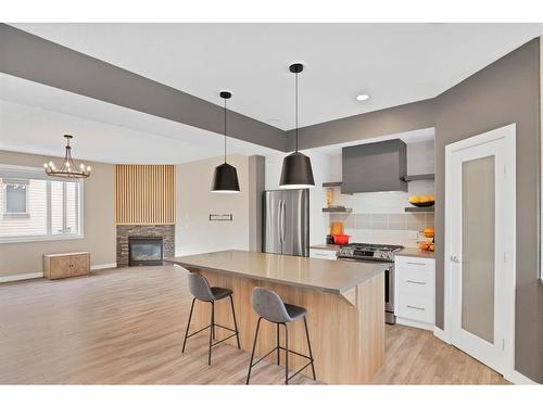 4-1918 32 Street Sw, Calgary, AB - Indoor Photo Showing Kitchen With Fireplace