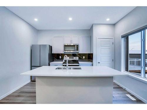 19 Marmot Way Nw, Calgary, AB - Indoor Photo Showing Kitchen With Double Sink With Upgraded Kitchen