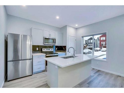 19 Marmot Way Nw, Calgary, AB - Indoor Photo Showing Kitchen With Stainless Steel Kitchen With Double Sink