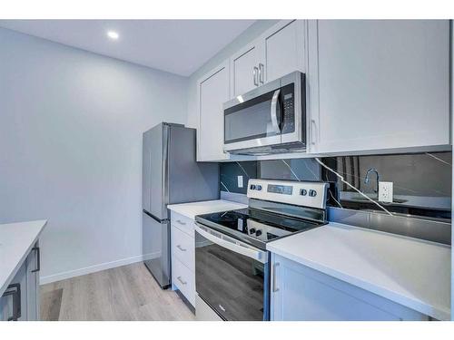 19 Marmot Way Nw, Calgary, AB - Indoor Photo Showing Kitchen With Stainless Steel Kitchen