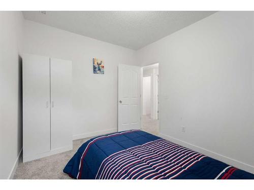 53 Strathlea Grove Sw, Calgary, AB - Indoor Photo Showing Bedroom