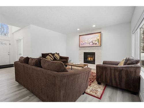 53 Strathlea Grove Sw, Calgary, AB - Indoor Photo Showing Living Room With Fireplace