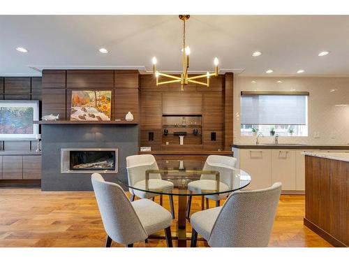 10-4907 8 Street Sw, Calgary, AB - Indoor Photo Showing Dining Room With Fireplace