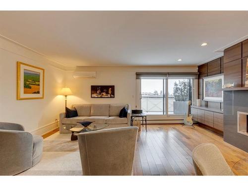 10-4907 8 Street Sw, Calgary, AB - Indoor Photo Showing Living Room With Fireplace