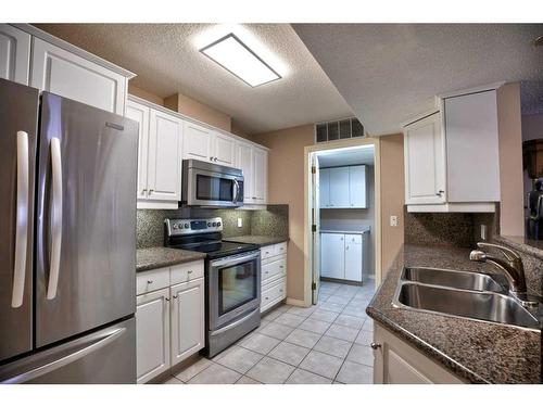 211-9449 19 Street Sw, Calgary, AB - Indoor Photo Showing Kitchen With Stainless Steel Kitchen With Double Sink