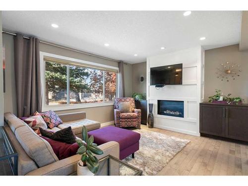 164 Havenhurst Crescent Sw, Calgary, AB - Indoor Photo Showing Living Room With Fireplace