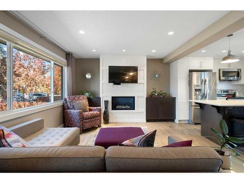 164 Havenhurst Crescent Sw, Calgary, AB - Indoor Photo Showing Living Room With Fireplace