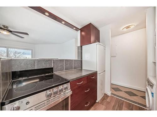 41-2414 14A Street Sw, Calgary, AB - Indoor Photo Showing Kitchen With Double Sink