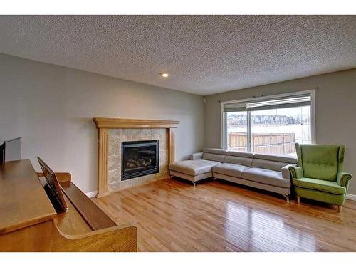 92 Covehaven Terrace Ne, Calgary, AB - Indoor Photo Showing Living Room With Fireplace