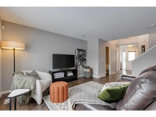 93 Cougarstone Place Sw, Calgary, AB - Indoor Photo Showing Living Room