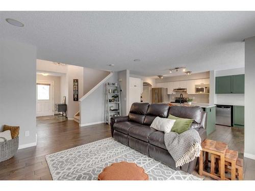 93 Cougarstone Place Sw, Calgary, AB - Indoor Photo Showing Living Room