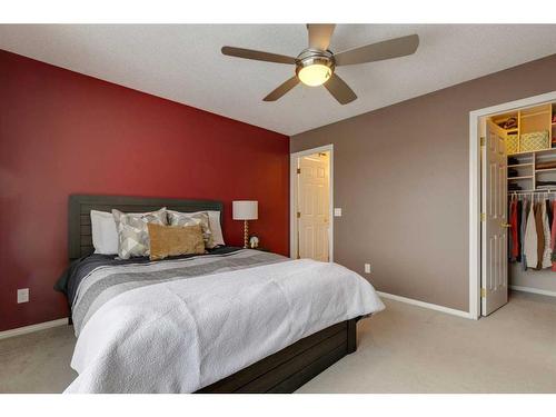 93 Cougarstone Place Sw, Calgary, AB - Indoor Photo Showing Bedroom