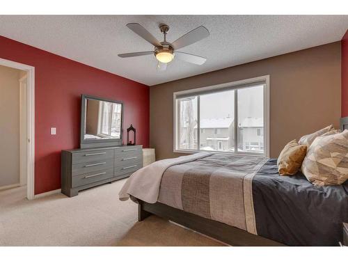 93 Cougarstone Place Sw, Calgary, AB - Indoor Photo Showing Bedroom