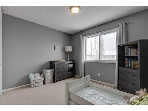 93 Cougarstone Place Sw, Calgary, AB - Indoor Photo Showing Bedroom