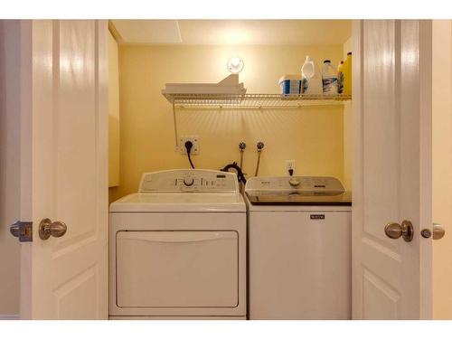 93 Cougarstone Place Sw, Calgary, AB - Indoor Photo Showing Laundry Room