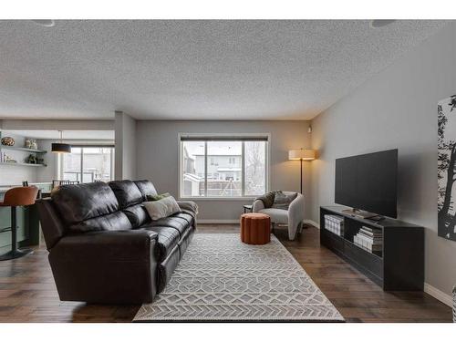 93 Cougarstone Place Sw, Calgary, AB - Indoor Photo Showing Living Room