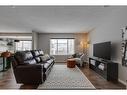 93 Cougarstone Place Sw, Calgary, AB  - Indoor Photo Showing Living Room 