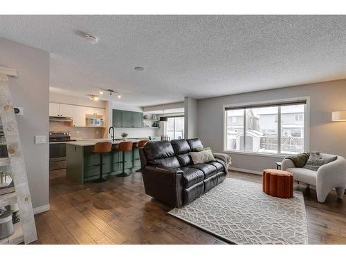 93 Cougarstone Place Sw, Calgary, AB - Indoor Photo Showing Living Room