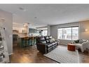 93 Cougarstone Place Sw, Calgary, AB  - Indoor Photo Showing Living Room 