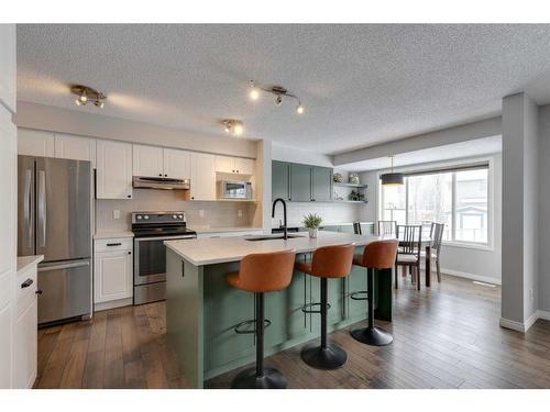 93 Cougarstone Place Sw, Calgary, AB - Indoor Photo Showing Kitchen With Upgraded Kitchen