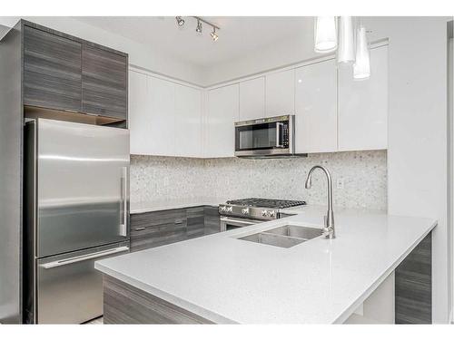 3318-95 Burma Star Road Sw, Calgary, AB - Indoor Photo Showing Kitchen With Stainless Steel Kitchen With Double Sink With Upgraded Kitchen