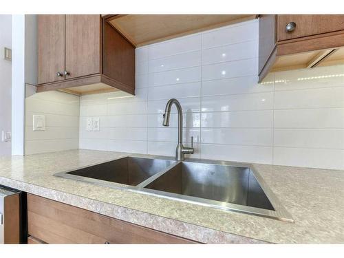 555 Woodpark Boulevard Sw, Calgary, AB - Indoor Photo Showing Kitchen With Double Sink