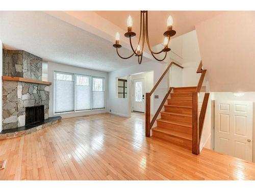 555 Woodpark Boulevard Sw, Calgary, AB - Indoor With Fireplace