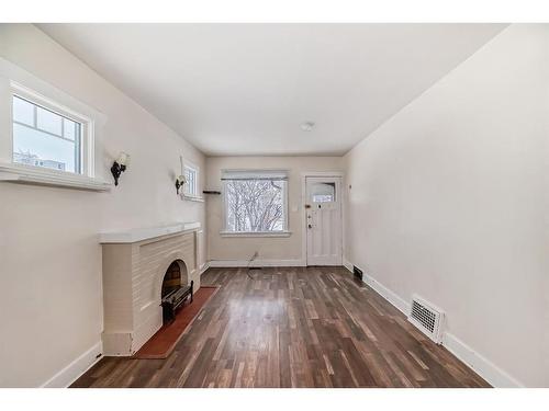 301 15 Avenue Ne, Calgary, AB - Indoor Photo Showing Other Room With Fireplace