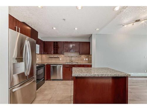 605-77 Spruce Place Sw, Calgary, AB - Indoor Photo Showing Kitchen With Stainless Steel Kitchen