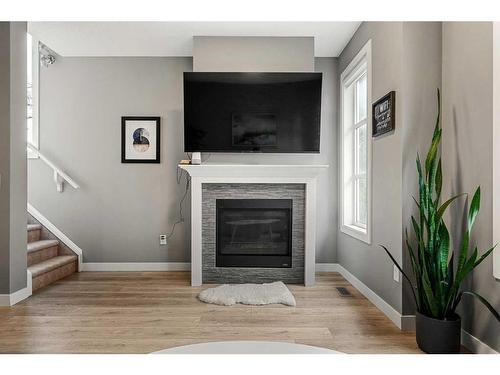 3-1930 26A Street Sw, Calgary, AB - Indoor Photo Showing Living Room With Fireplace