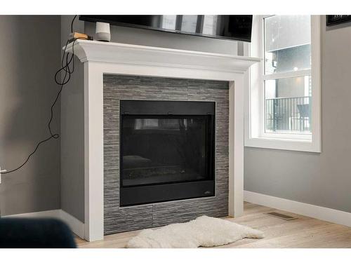 3-1930 26A Street Sw, Calgary, AB - Indoor Photo Showing Living Room With Fireplace