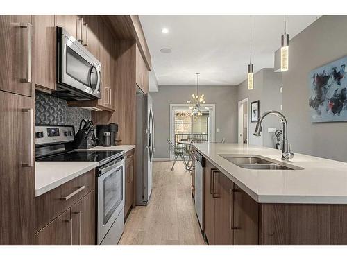 3-1930 26A Street Sw, Calgary, AB - Indoor Photo Showing Kitchen With Double Sink With Upgraded Kitchen