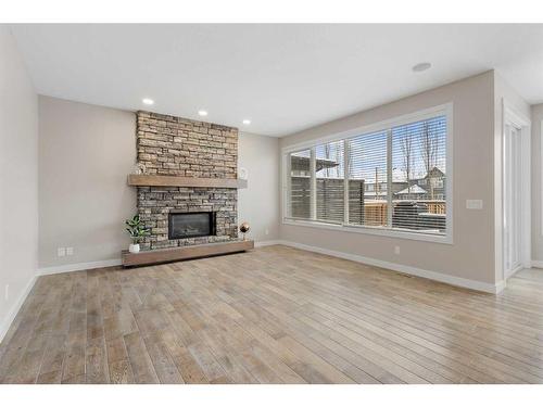 30 Marquis Heights Se, Calgary, AB - Indoor Photo Showing Living Room With Fireplace