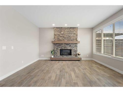 30 Marquis Heights Se, Calgary, AB - Indoor Photo Showing Living Room With Fireplace