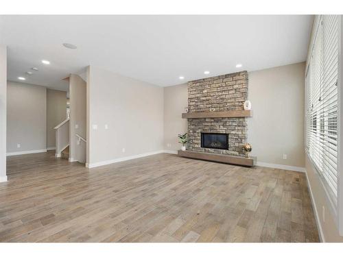 30 Marquis Heights Se, Calgary, AB - Indoor Photo Showing Living Room With Fireplace